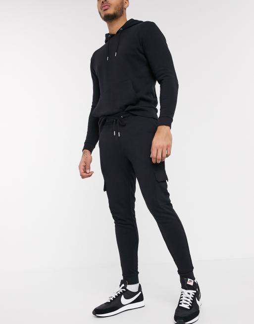 ASOS DESIGN tracksuit with hoodie & skinny cargo joggers in black