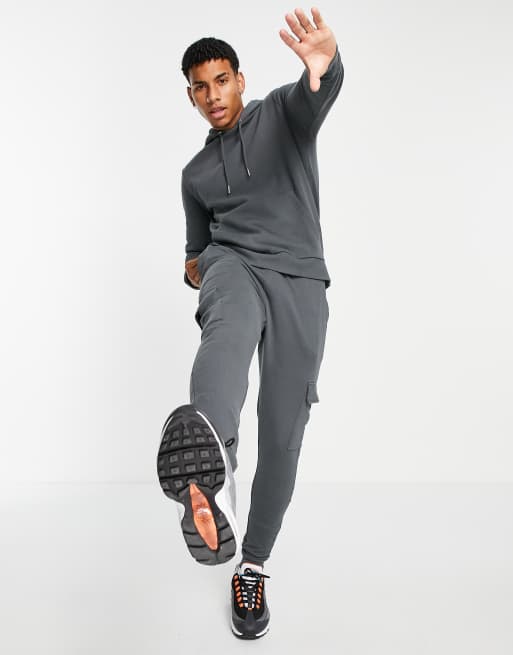 ASOS DESIGN tracksuit with hoodie skinny cargo joggers in washed black