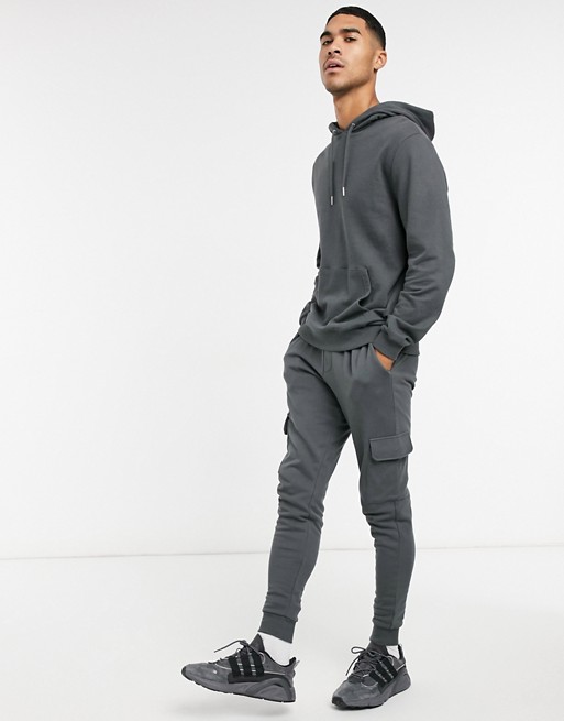 ASOS DESIGN tracksuit with hoodie & skinny cargo joggers in washed black