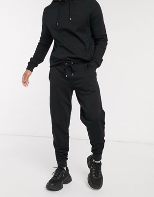 black hoodie and sweatpants