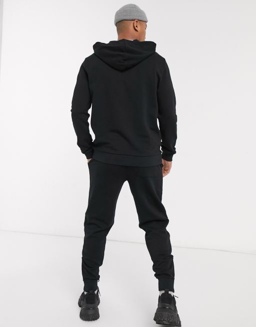 ASOS DESIGN tracksuit with hoodie sweatpants with silver zip in black