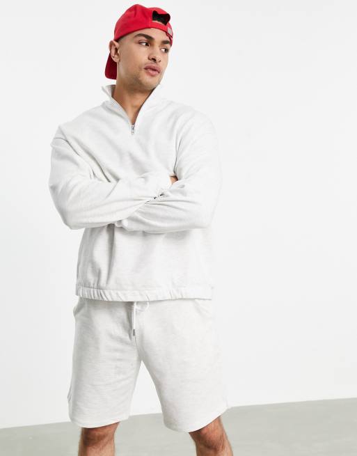 ASOS DESIGN tracksuit with oversized half zip sweatshirt and oversized shorts in white heather