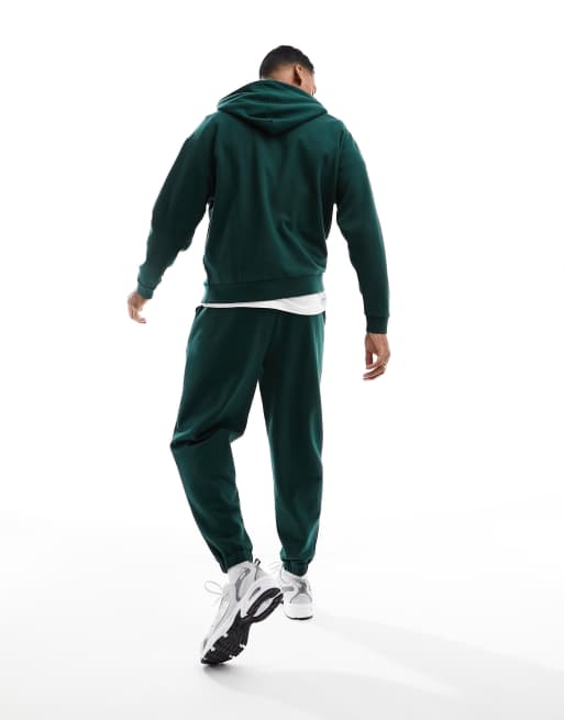 ASOS DESIGN tracksuit with oversized hoodie and jogger in dark green