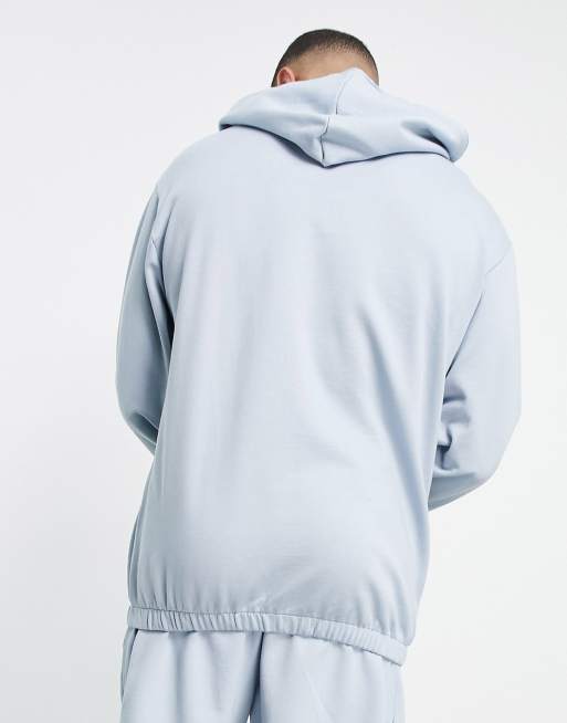 ASOS DESIGN tracksuit with oversized hoodie and super oversized joggers with toggles in pastel blue
