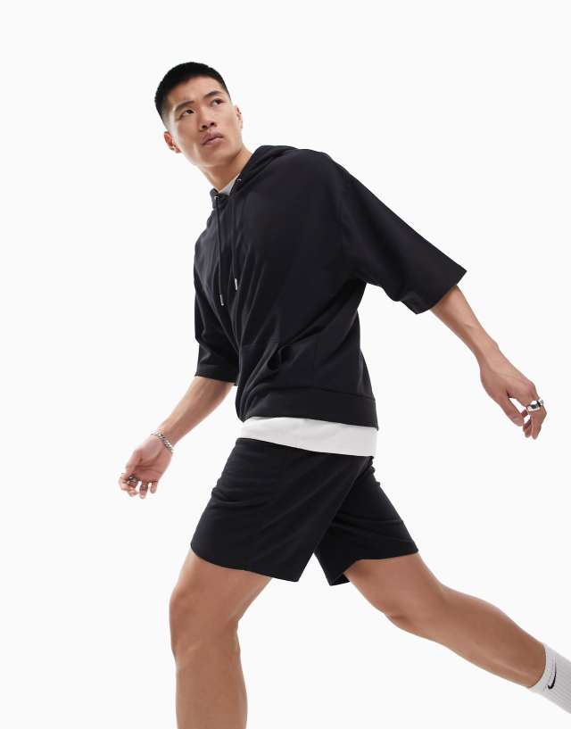 ASOS DESIGN tracksuit with oversized short sleeve hoodie & slim shorts in black