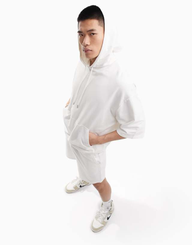 ASOS DESIGN tracksuit with oversized short sleeve hoodie & slim shorts in soft white