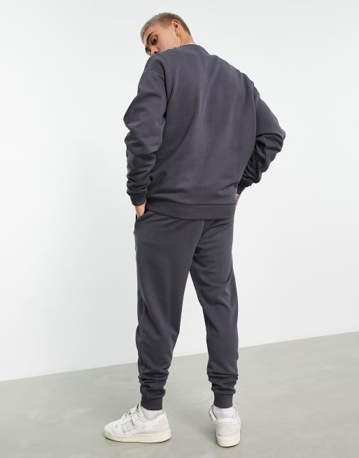 ASOS DESIGN tracksuit with oversized sweatshirt and tapered joggers in washed black