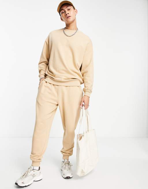 ASOS DESIGN tracksuit with oversized sweatshirt and tapered trackies in beige
