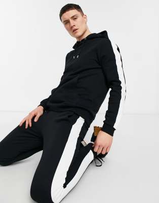 ASOS DESIGN tracksuit with side stripe in black