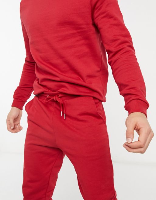 ASOS DESIGN tracksuit with sweatshirt and skinny joggers in red - RED