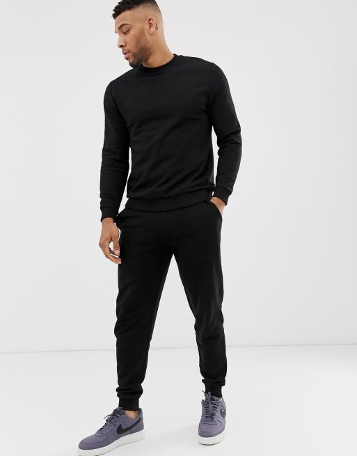 ASOS DESIGN tracksuit with tapered joggers in black | ASOS