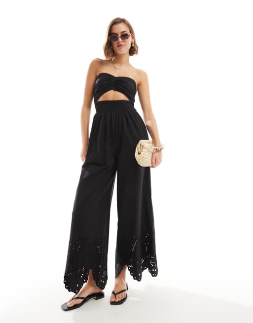 ASOS DESIGN Tragerloser bestickter Jumpsuit in Schwarz mit verdrehter Vorderseite und Zierausschnitt ASOS