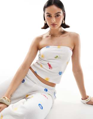 ASOS DESIGN - Trägerloses Oberteil in Weiß mit Waffelstruktur und Urlaubsmotiv-Stickereien, Kombiteil