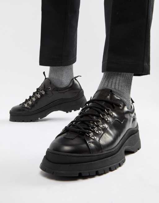 Black leather store trainer shoes