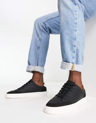 ASOS DESIGN trainers in black with faux suede panels