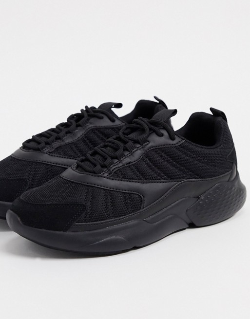 ASOS DESIGN trainers in mixed materials in black