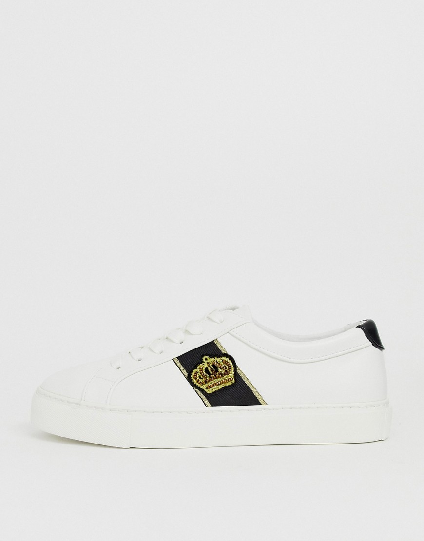 ASOS DESIGN trainers in white with crown badge embroidery