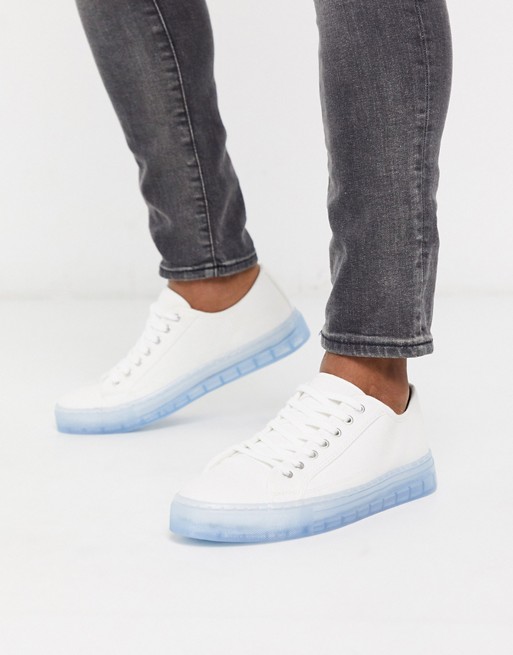 ASOS DESIGN trainers in white with translucent blue sole
