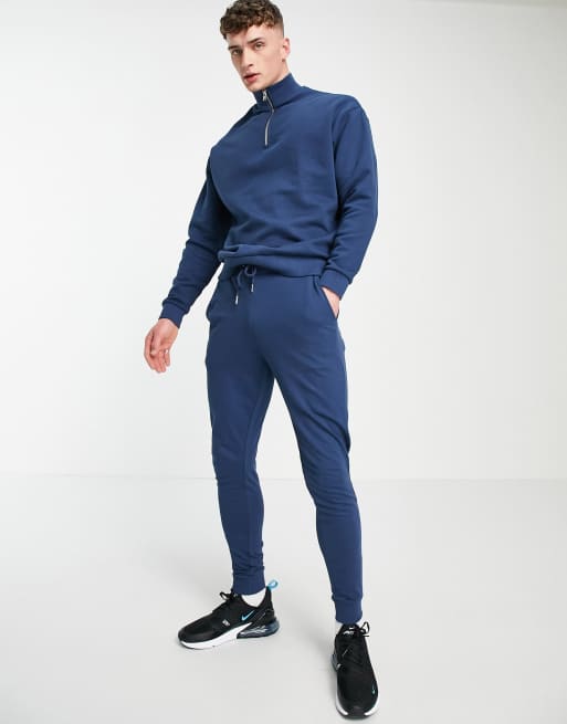 ASOS DESIGN – Trainingsanzug aus Sweatshirt mit kurzem Reißverschluss & enger Jogginghose in Blau