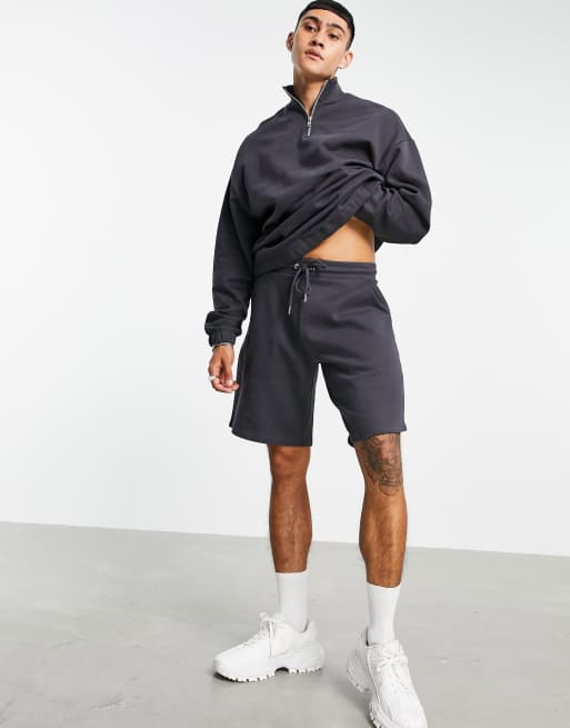 ASOS DESIGN - Trainingspak met oversized sweatshirt met korte rits en oversized short in zwart met wassing
