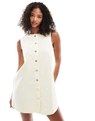ASOS DESIGN trapeze denim mini dress with button opening in pale yellow - view 1