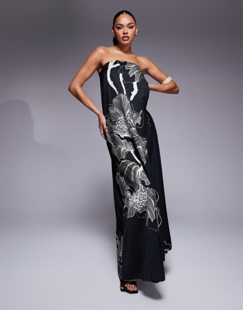 ASOS DESIGN – Trapezförmiges, trägerloses Maxikleid aus Satin in Schwarz mit Oversize-Blumenmuster - view 1