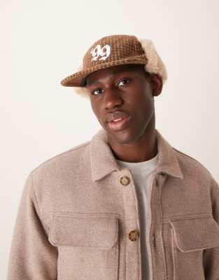 trapper cap in heritage check in brown