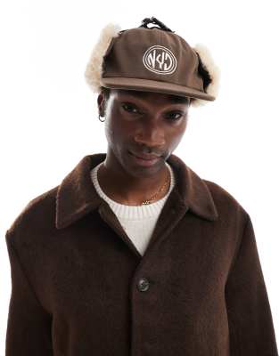 trapper cap with embroidery detail in brown and ecru