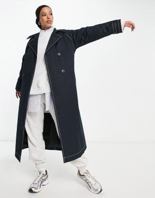 ASOS DESIGN - Trench nero con cuciture a contrasto 
