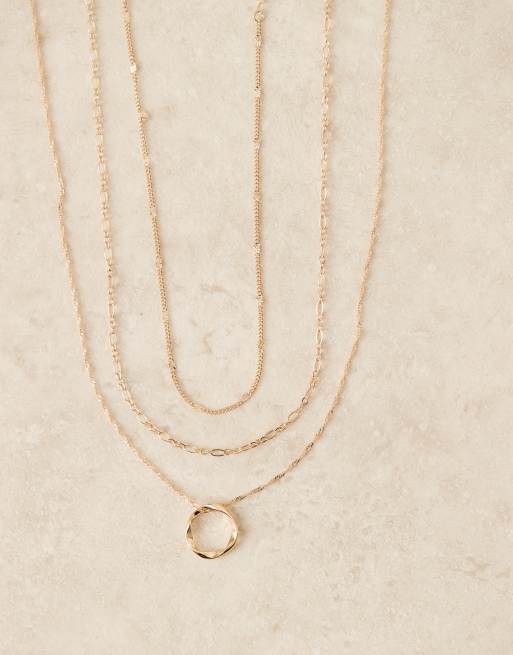 ASOS DESIGN triple multi-row necklace with circular pendant detail in gold tone, 2 of 3