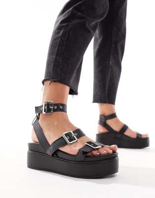 ASOS DESIGN - Trombone - Flache Sandalen in Schwarz mit Schnallendetail und dicker Sohle