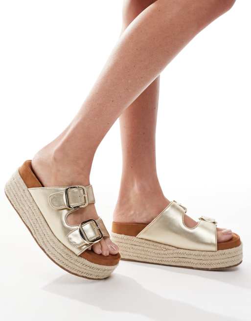 ASOS DESIGN Trooper buckle detail flatform mules in gold