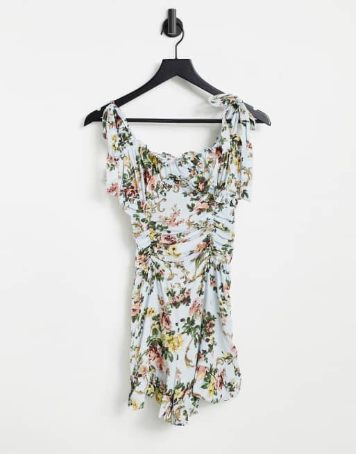 ASOS DESIGN - Tuta corta svasata con stampa a fiori anticata