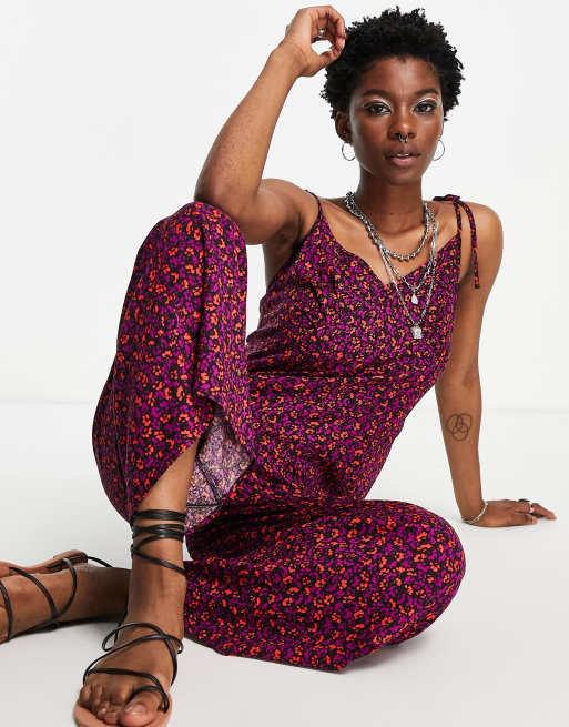 ASOS DESIGN - Tuta jumpsuit anni '90 allacciata sulle spalle con stampa a fiori scura