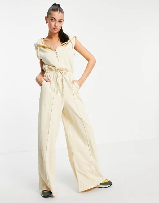 ASOS DESIGN - Tuta jumpsuit con felpa con cappuccio senza maniche e joggers a fondo ampio color avena