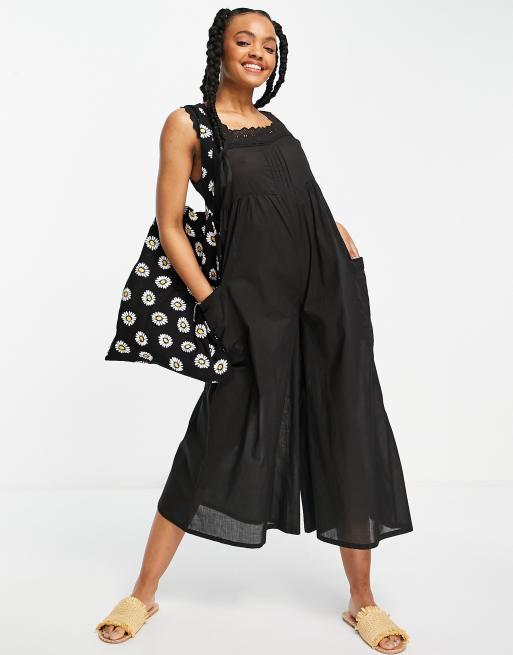 ASOS DESIGN - Tuta jumpsuit con finiture in pizzo colore nero