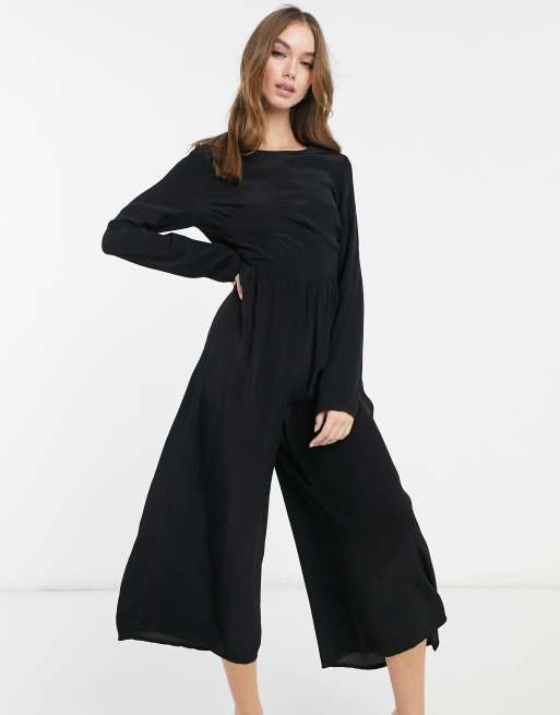 ASOS DESIGN - Tuta jumpsuit da giorno a maniche lunghe con bottoni sul retro nera