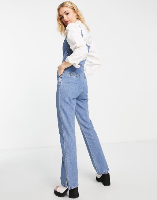 ASOS DESIGN - Tuta jumpsuit di jeans svasata lavaggio medio