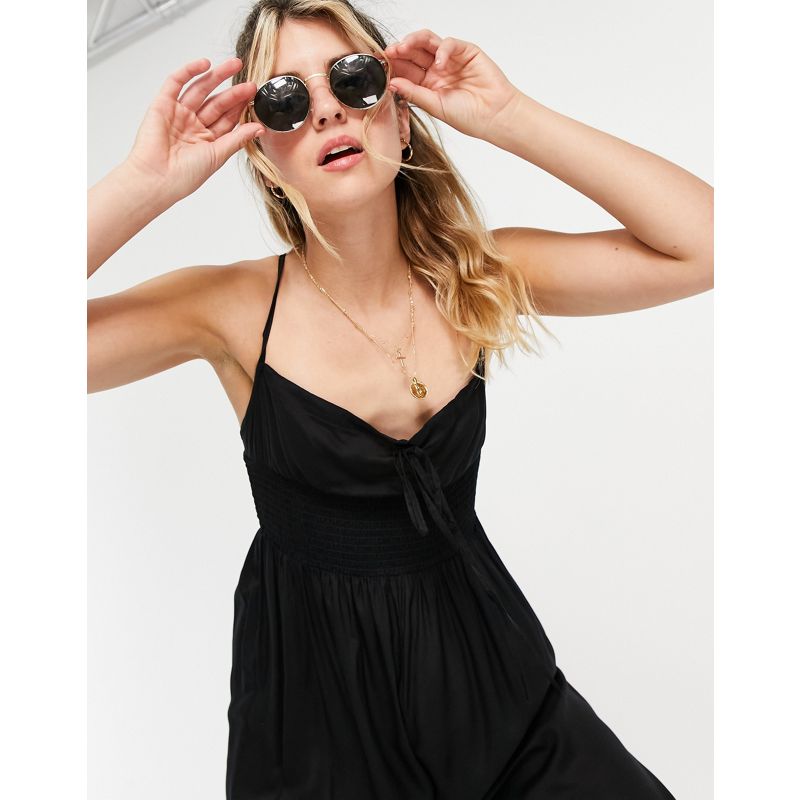 Donna Tute jumpsuit DESIGN - Tuta jumpsuit modello gonna pantalone nera con vita arricciata e laccetti sul davanti