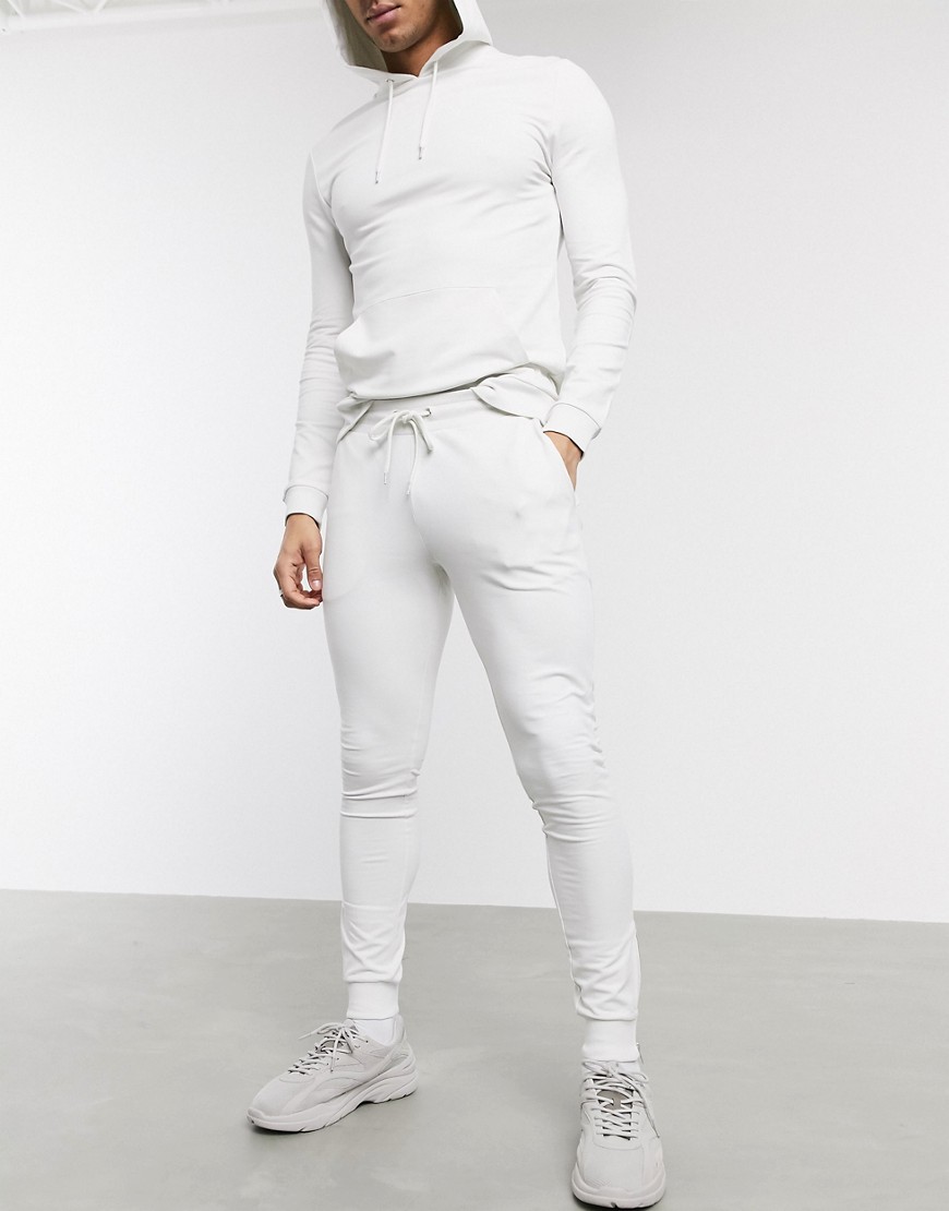 ASOS DESIGN - Tuta sportiva attillata con felpa con cappuccio e joggers con zip argento grigio chiaro