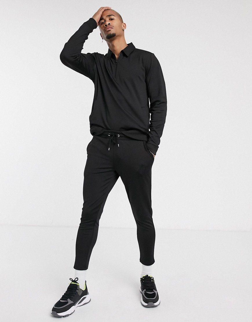 ASOS DESIGN - Tuta sportiva in tricot di poliestere nera con zip corta-Grigio