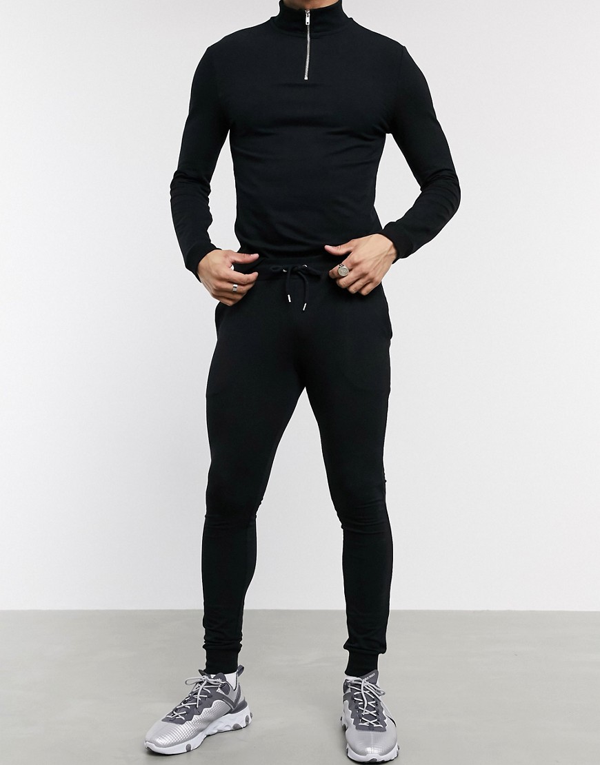 ASOS DESIGN - Tuta sportiva nera attillata con felpa con zip corta-Nero