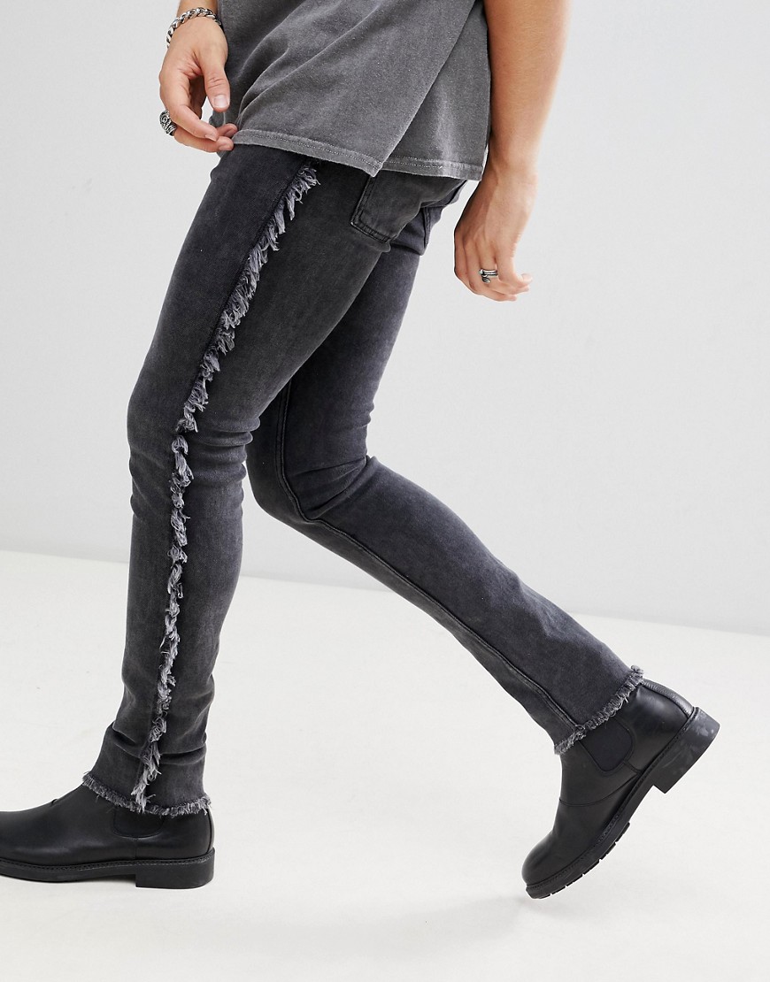 ASOS DESIGN – Tvättade svarta superskinny jeans med fransig sidorand
