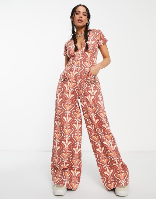 ASOS DESIGN retro floral flare pants in orange