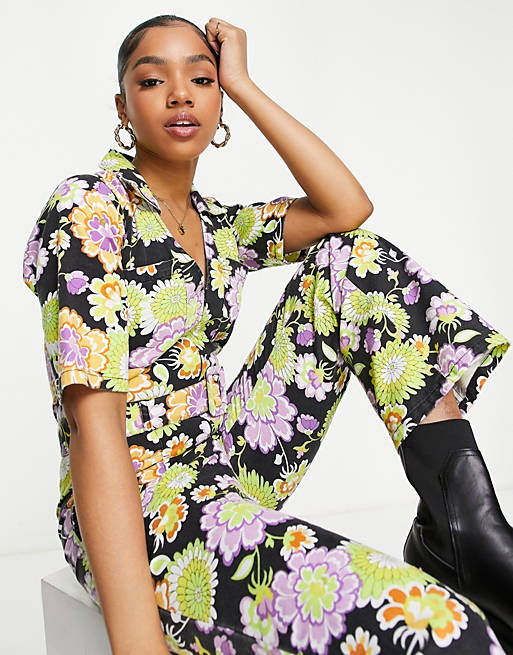 Women twill short sleeve zip front buckle fit and flare jumpsuit in retro floral 