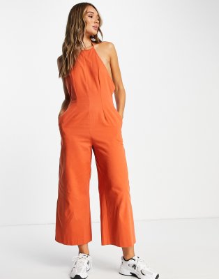 Shop ASOS DESIGN twill strappy halter neck jumpsuit with wide leg in Online – Trendy & Affordable Fashion