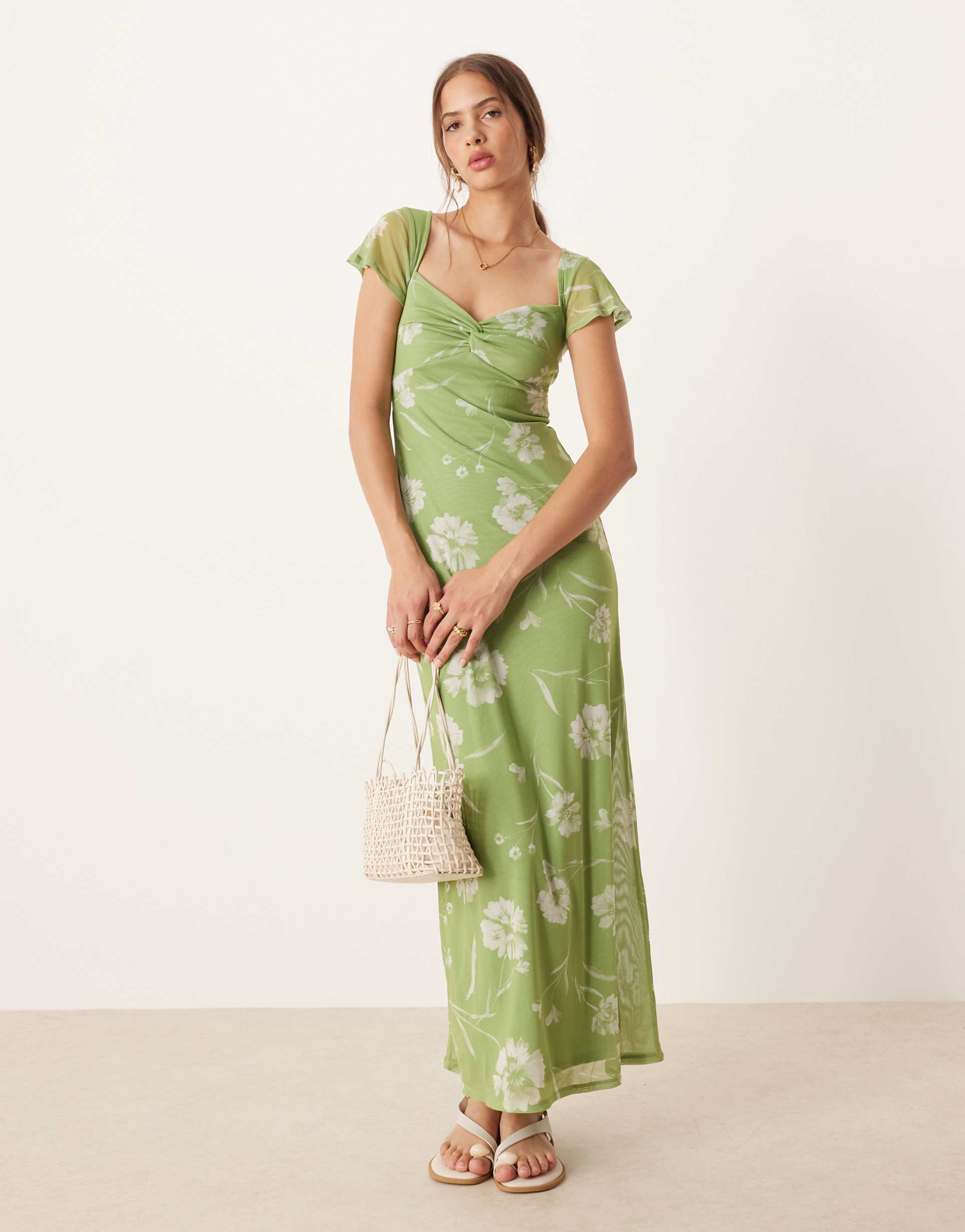 asos design twist front flutter sleeve midi tea dress in green floral print