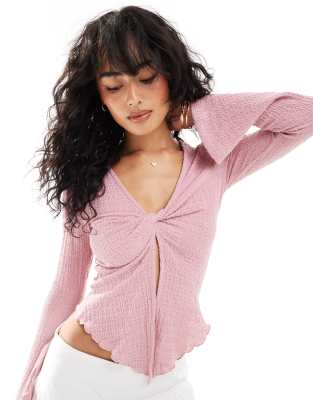 Shop ASOS DESIGN twist front long sleeve flute top in pink Online – Trendy & Affordable Fashion