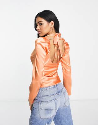 ASOS DESIGN twist front satin blouse with halter neck in peach