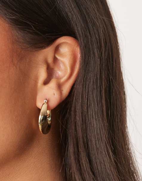 ASOS DESIGN twist hoops earrings in gold tone - view 1